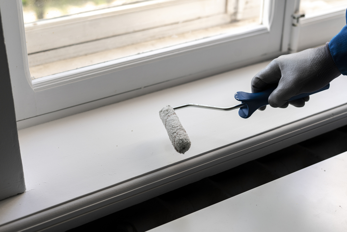 professional painter doing his job holding a paint roller