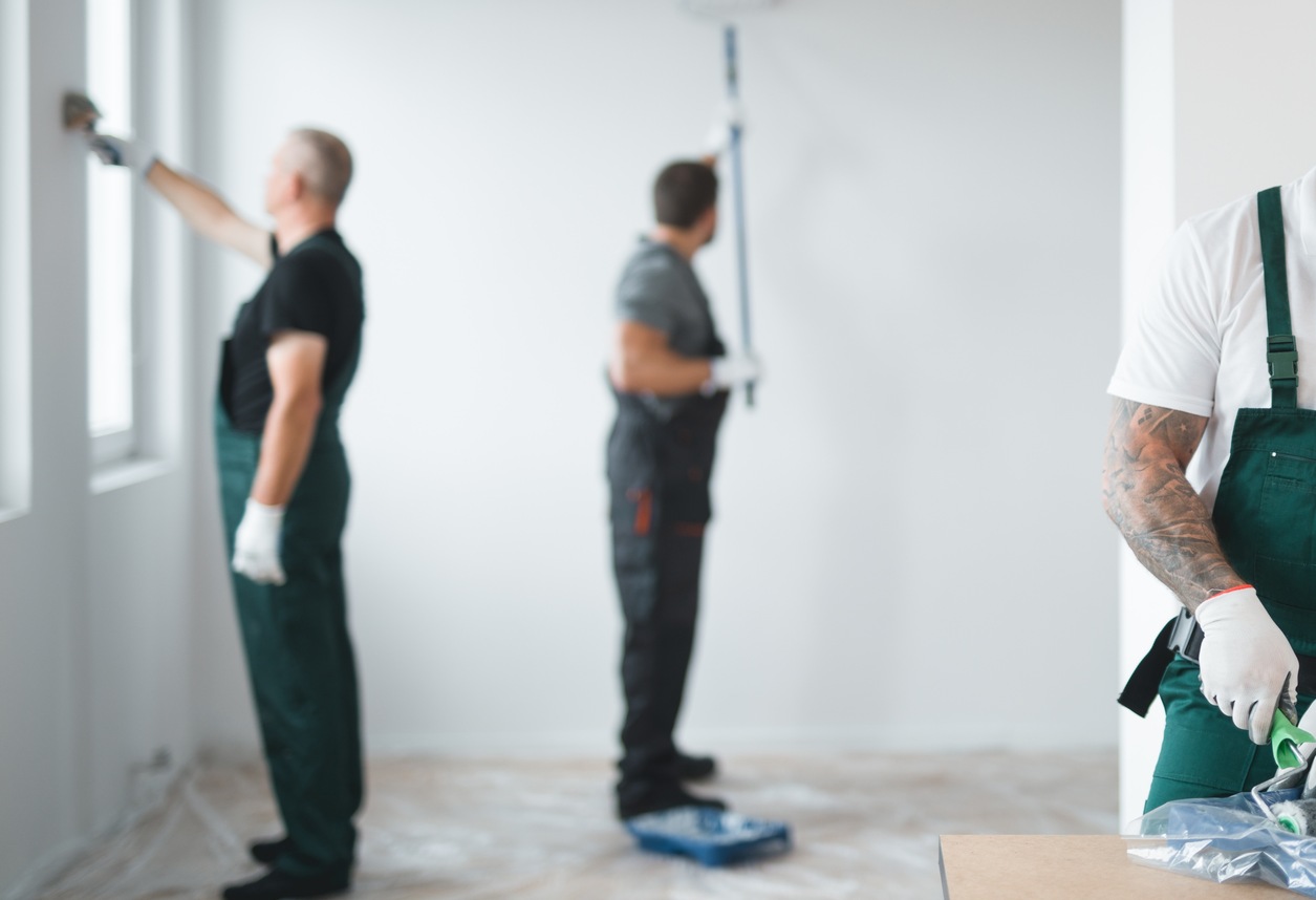 Builder preparing to paint the apartment during renovation